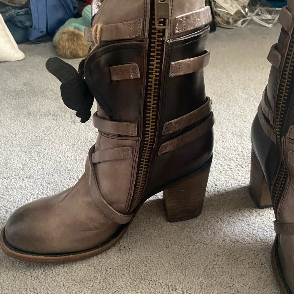 Hand crafted, hand made, leather zip up boots. Come up about half way the calf.